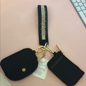 Lululemon Athletica Black and gold dual pouch wristlet